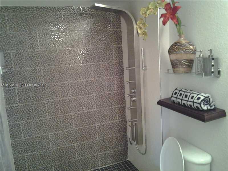 15480 Southwest 284th Street, Unit 2207 Homestead, FL 33033 - Photo 4 of 12 a bathroom with a toilet and a shower