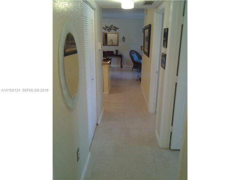15480 Southwest 284th Street, Unit 2207 Homestead, FL 33033 - Photo 6 of 12 a view of a hallway with living room