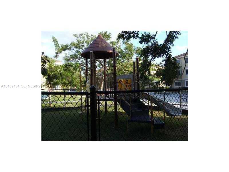 15480 Southwest 284th Street, Unit 2207 Homestead, FL 33033 - Photo 10 of 12 a view of a porch with furniture and a yard
