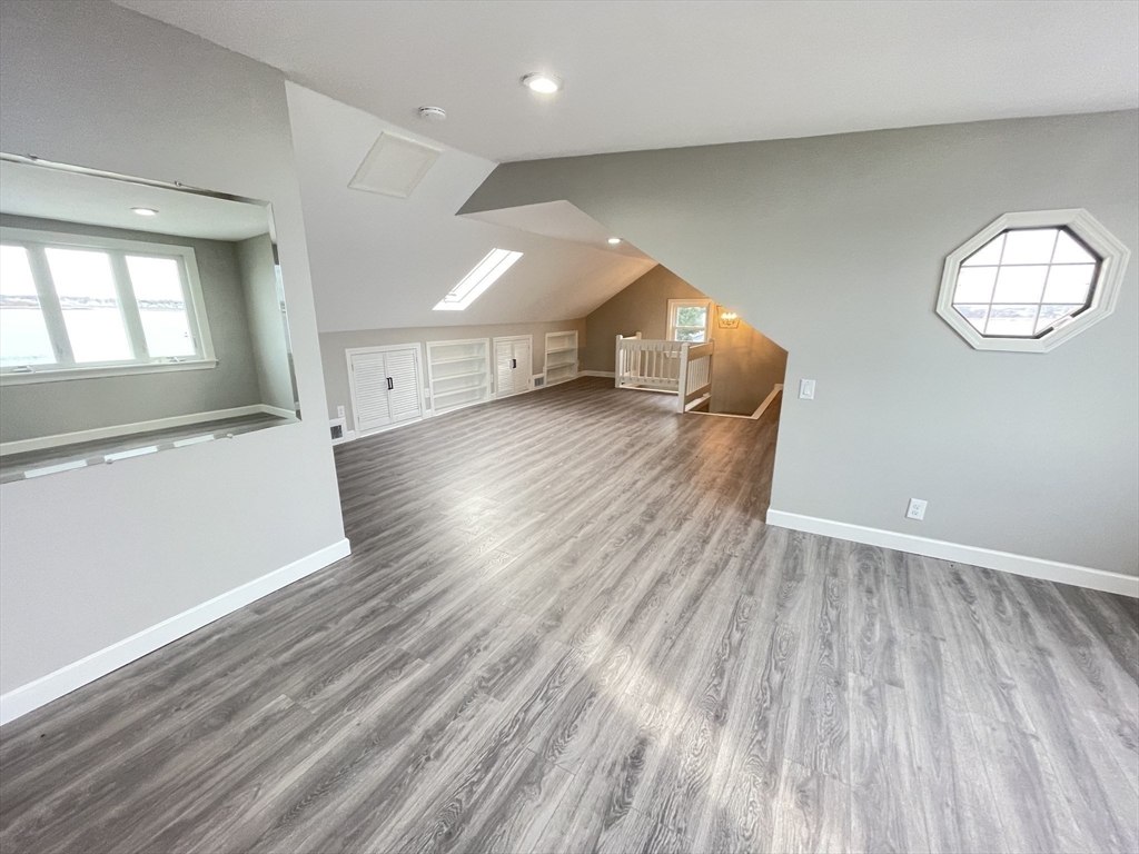 85 Regatta Road Weymouth, MA 02191 - Photo 16 of 33 wooden floor in an empty room with a window