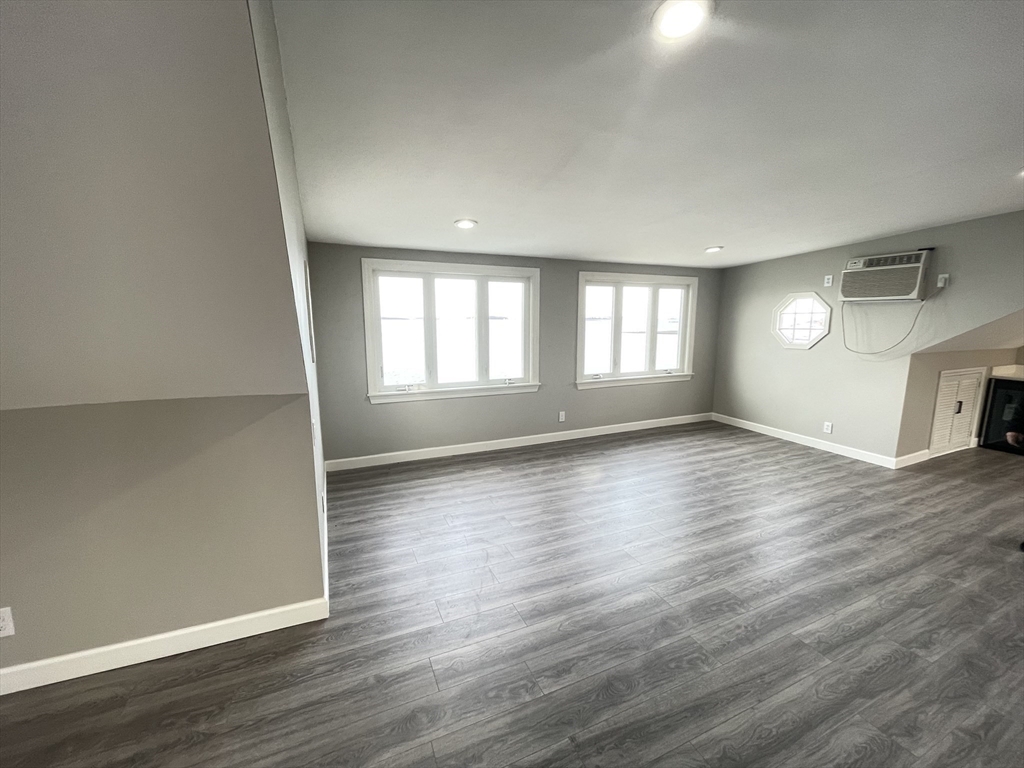 85 Regatta Road Weymouth, MA 02191 - Photo 17 of 33 an empty room with wooden floor and windows