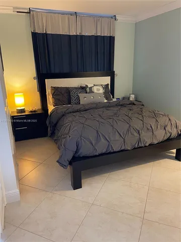 a bedroom with a bed and dresser