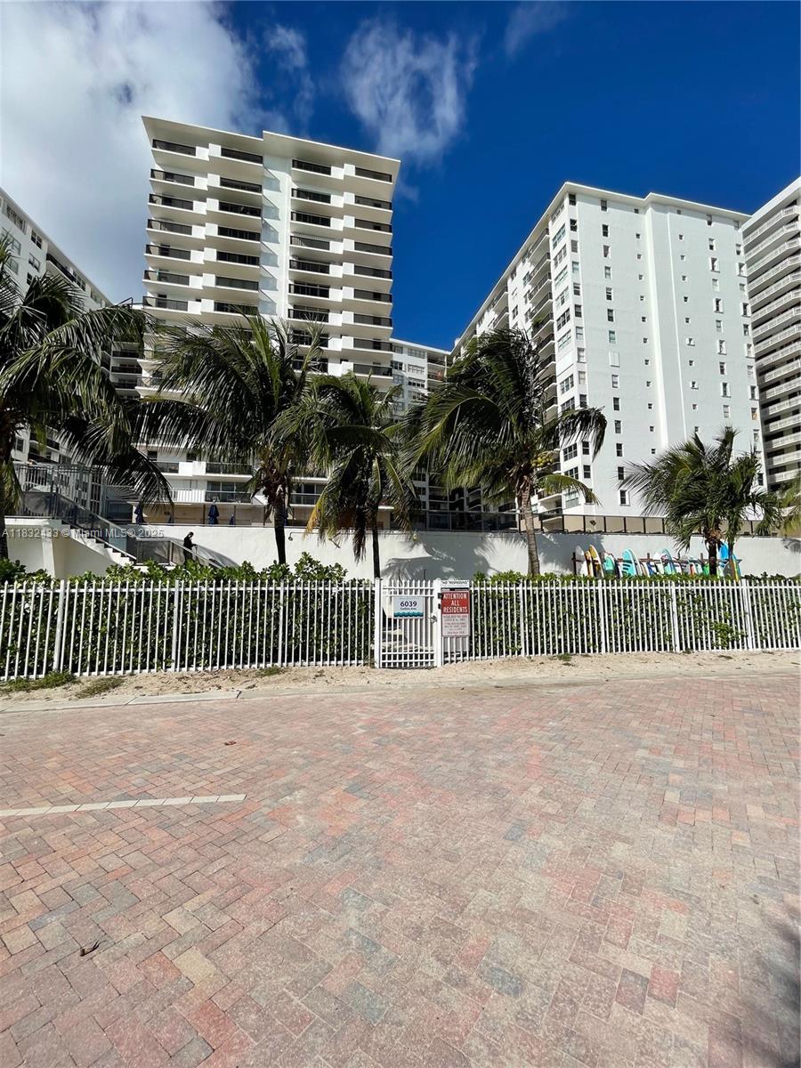 6039 Collins Avenue, Unit 823 Miami Beach, FL 33140 - Photo 15 of 21 a view of a balcony with a fence