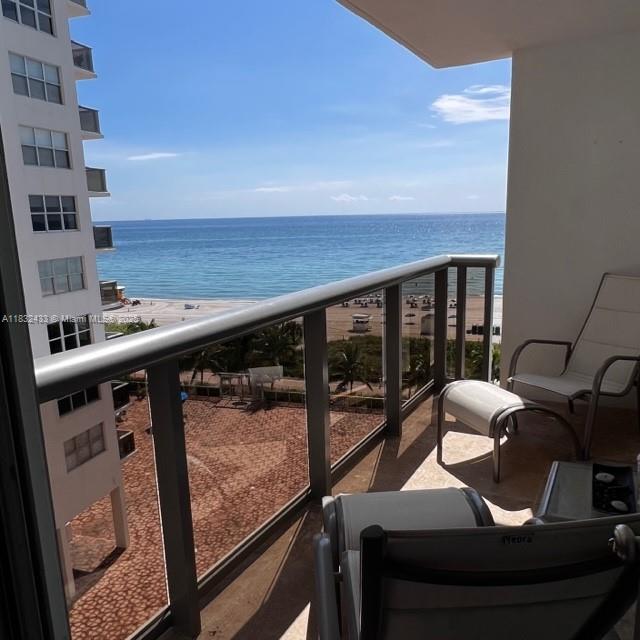 6039 Collins Avenue, Unit 823 Miami Beach, FL 33140 - Photo 2 of 21 a view of living room with furniture and floor to ceiling window