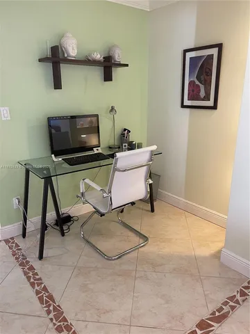 a view of a workspace with furniture