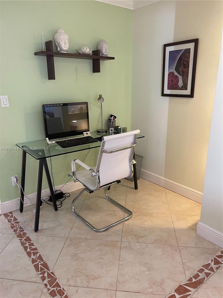 6039 Collins Avenue, Unit 823 Miami Beach, FL 33140 - Photo 8 of 21 a view of a workspace with furniture