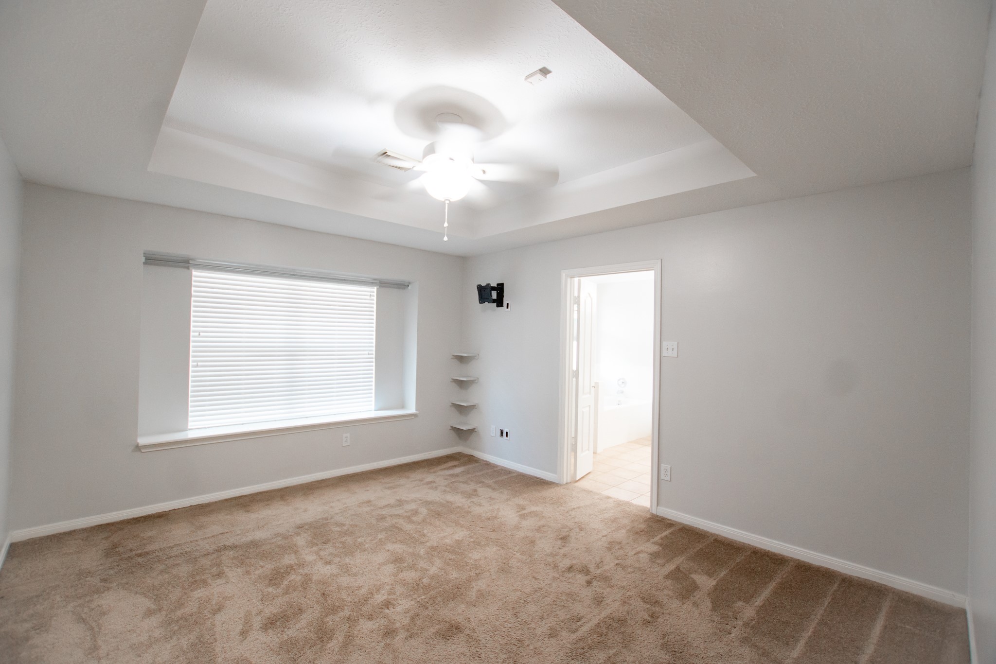 1722 Red Oak Terrace Houston, TX 77339 - Photo 12 of 22 an empty room with a window and a fan