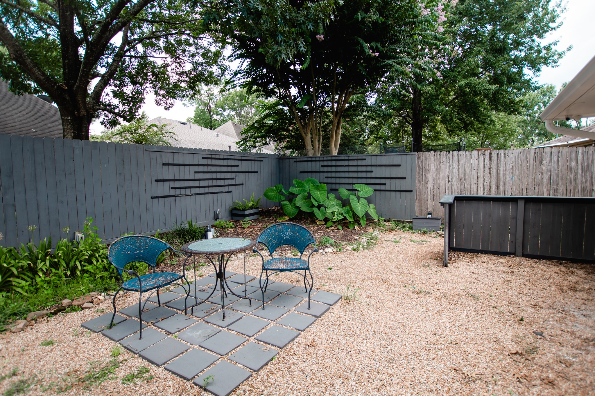 1722 Red Oak Terrace Houston, TX 77339 - Photo 16 of 22 a garden with a bench and some plants