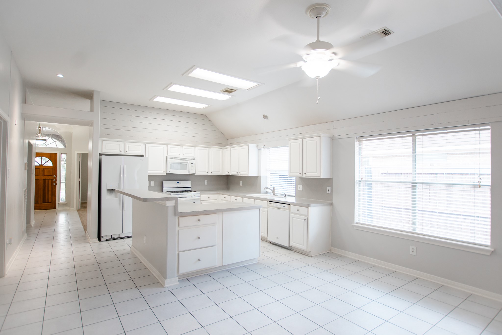 1722 Red Oak Terrace Houston, TX 77339 - Photo 2 of 22 a kitchen with white cabinets and appliances