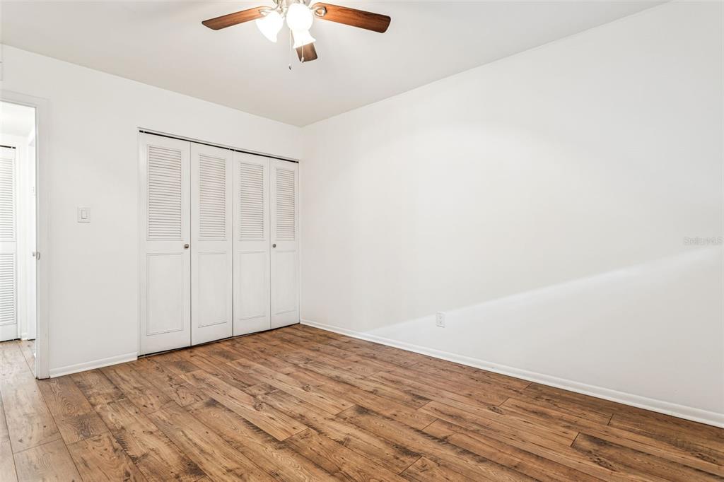 4606 West Gray Street, Unit 105 Tampa, FL 33609 - Photo 17 of 25 wooden floor in an empty room