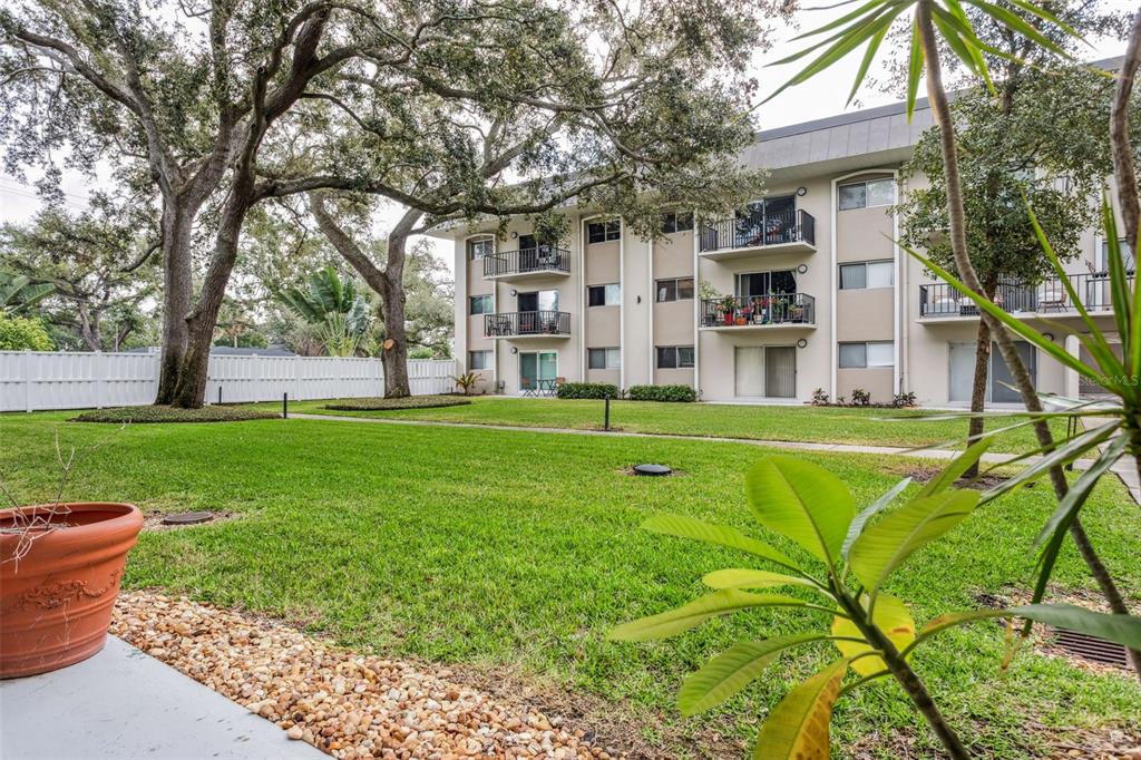 4606 West Gray Street, Unit 105 Tampa, FL 33609 - Photo 19 of 25 a view of a house with a backyard
