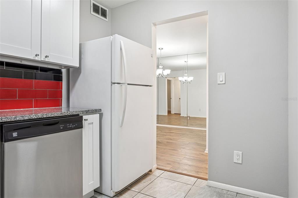 4606 West Gray Street, Unit 105 Tampa, FL 33609 - Photo 9 of 25 a view of a kitchen with refrigerator and cabinet