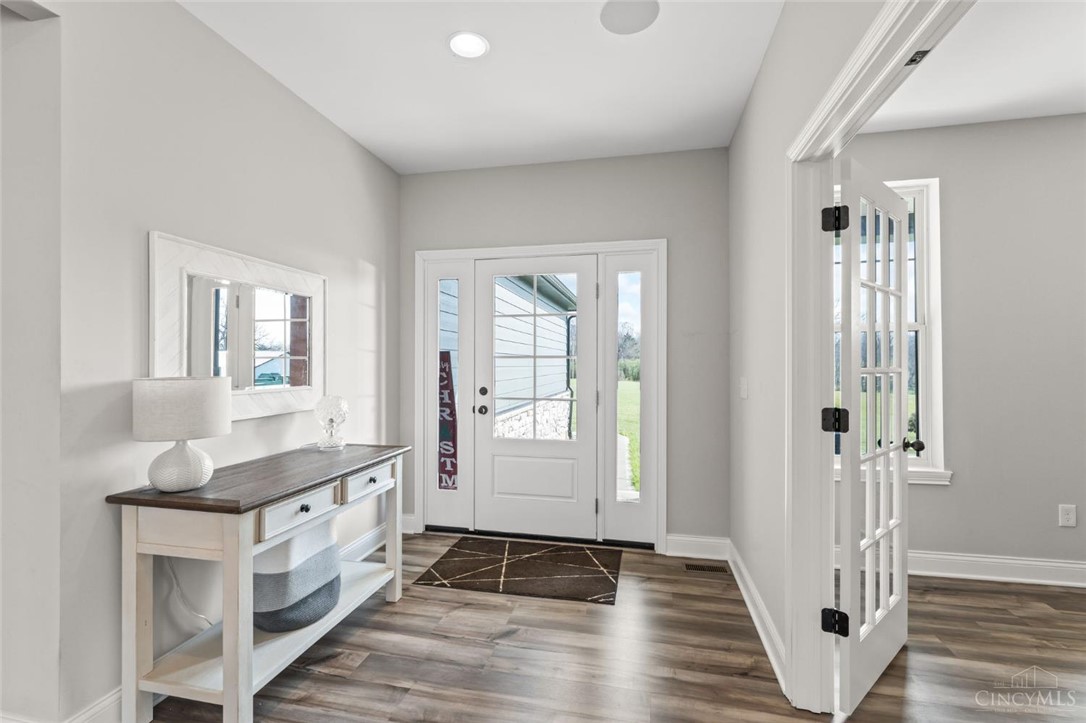 2425 Middleboro Road Clarksville, OH 45113 - Photo 26 of 91 This bright entryway features a large doorway, rich flooring, and a luminous interior.