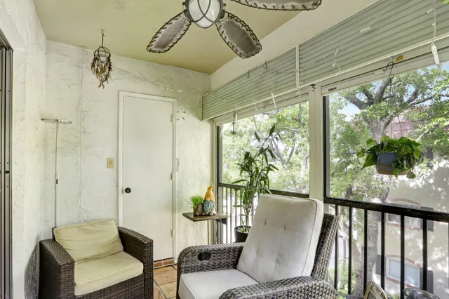 a view of balcony with furniture