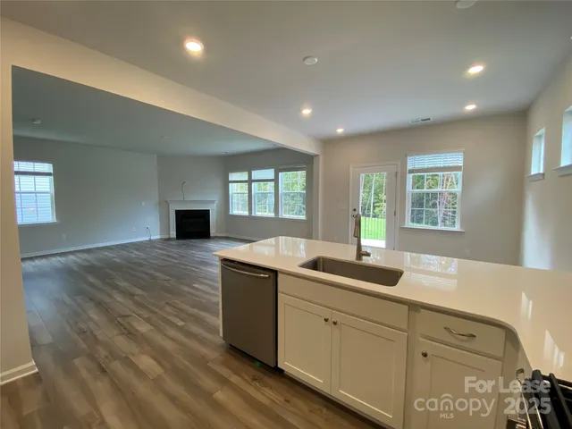 a kitchen with sink and window