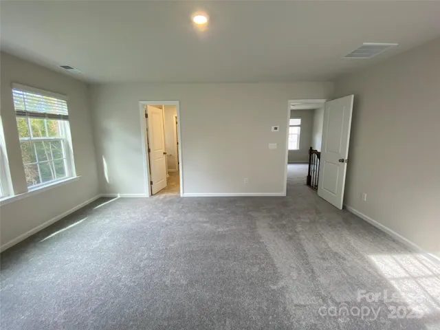 a bathroom with a shower sink and mirror