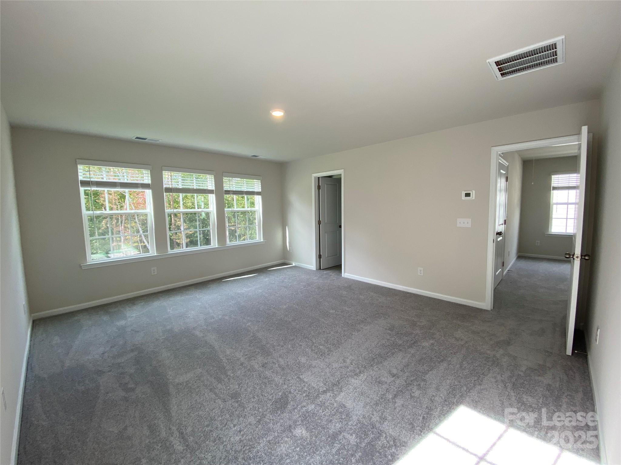 18219 Stark Way Charlotte, NC 28278 - Photo 22 of 42 a view of an empty room with a window