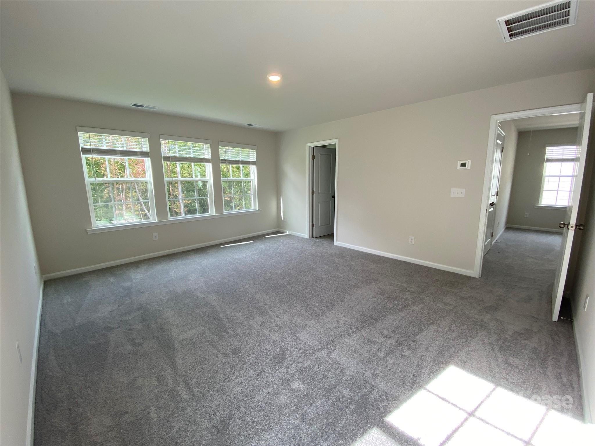 18219 Stark Way Charlotte, NC 28278 - Photo 24 of 42 a view of an empty room with a window