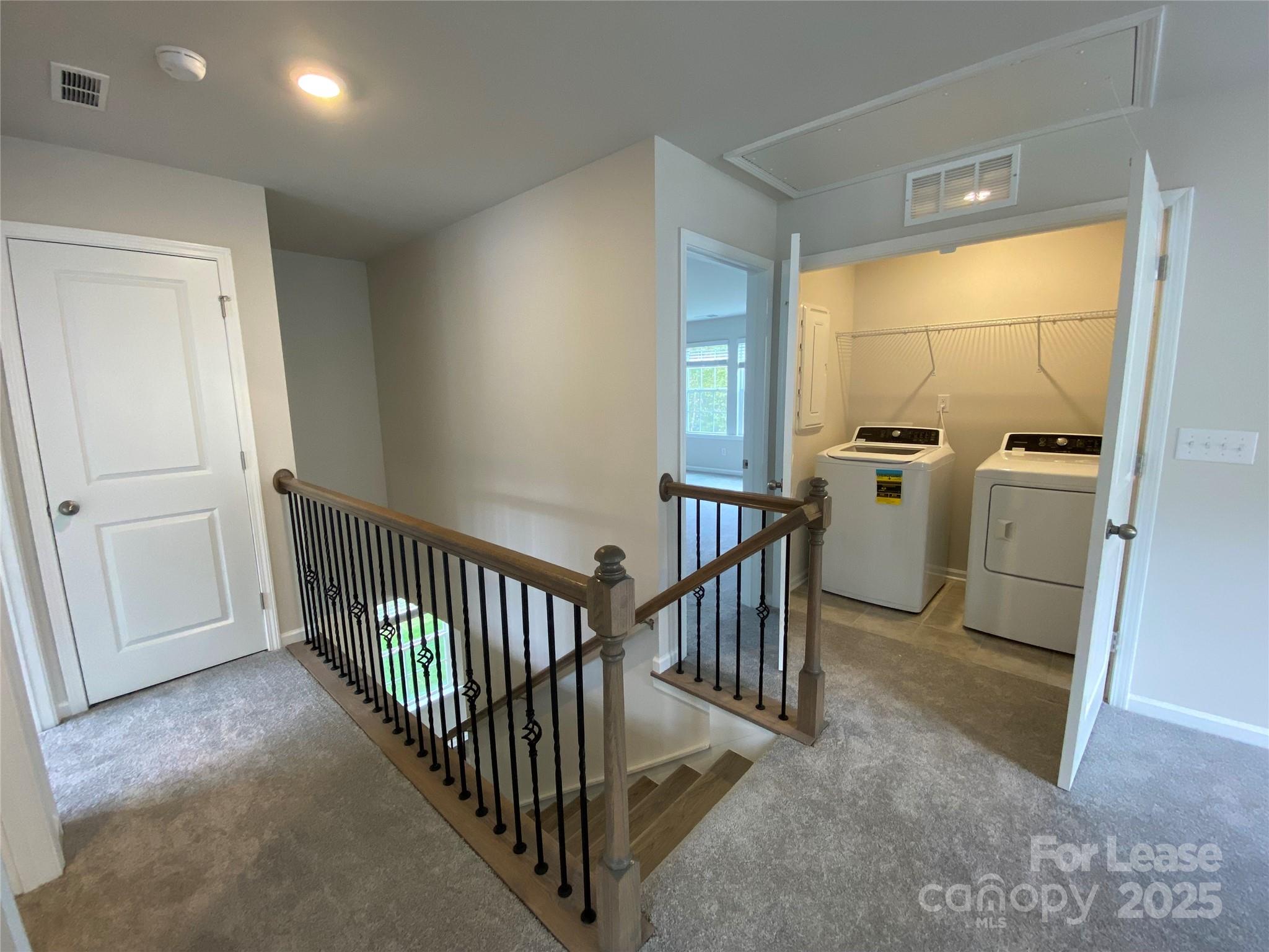 18219 Stark Way Charlotte, NC 28278 - Photo 27 of 42 a view of a hallway with workspace and windows