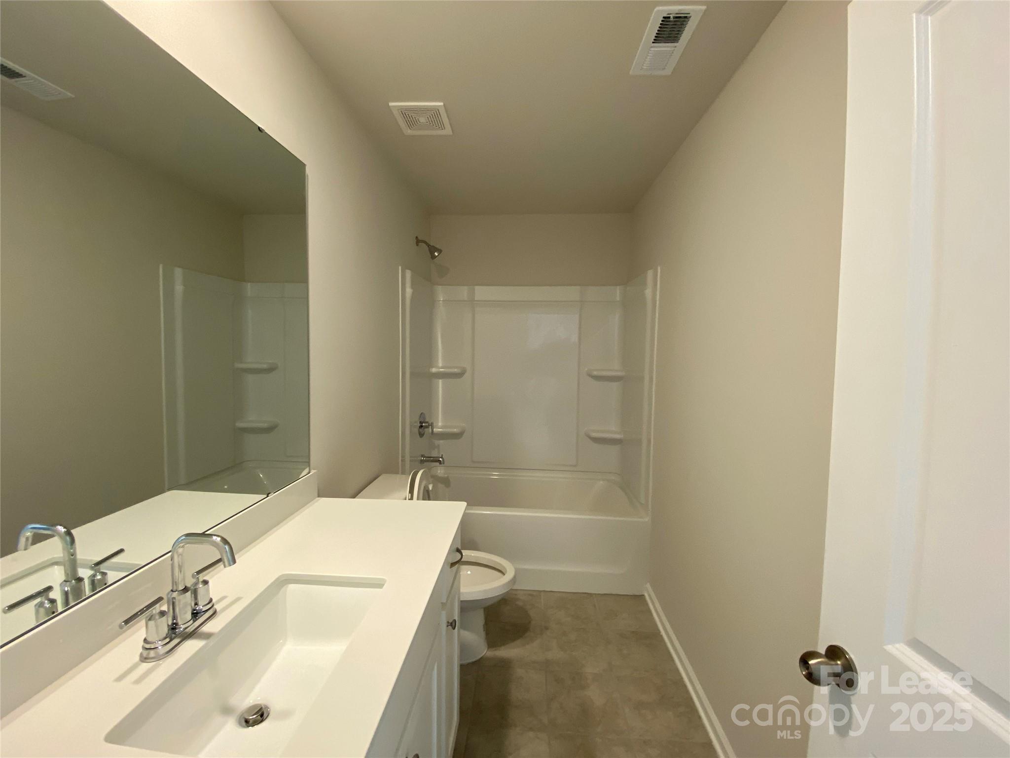 18219 Stark Way Charlotte, NC 28278 - Photo 28 of 42 a bathroom with a sink a toilet and shower