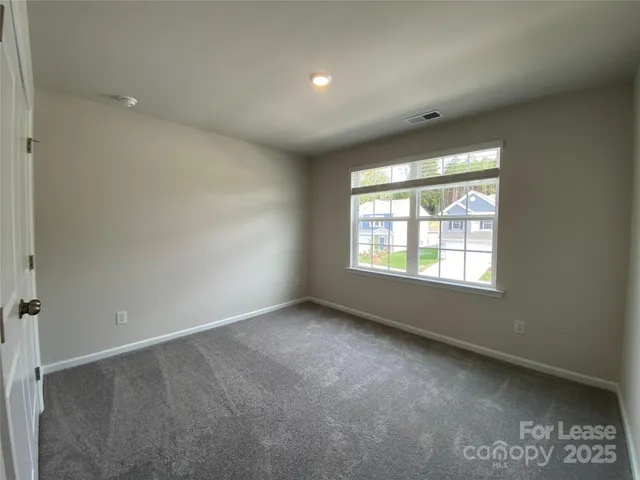 an empty room with a bathroom