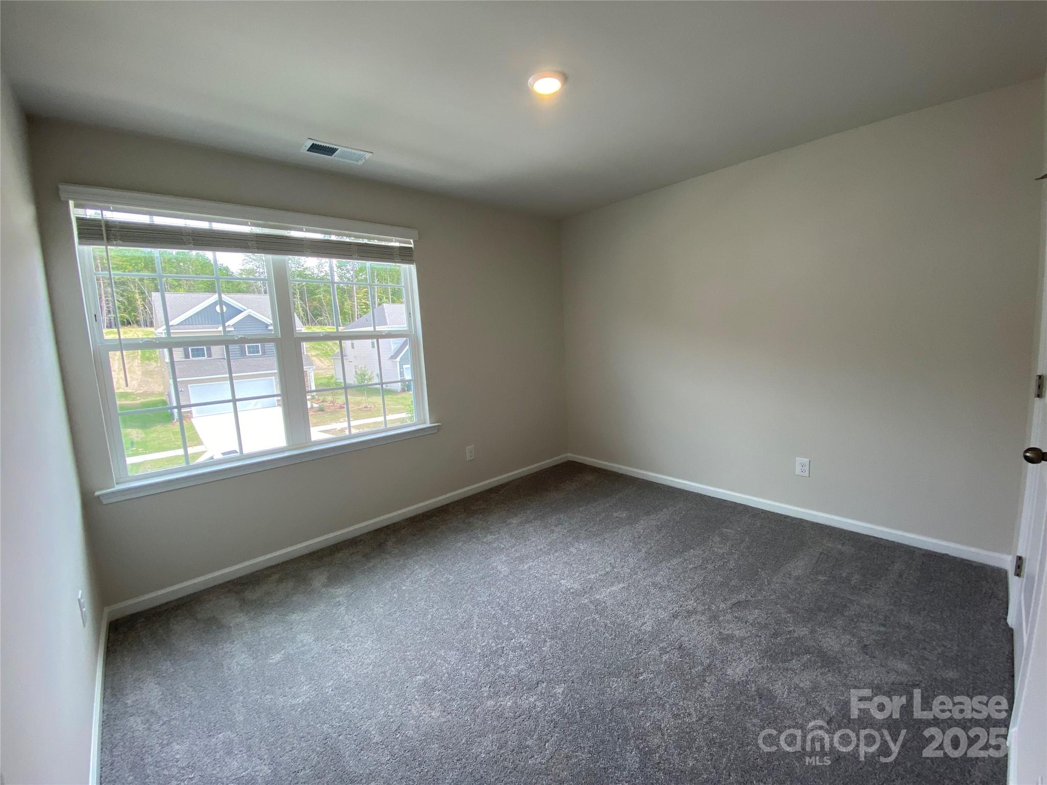 18219 Stark Way Charlotte, NC 28278 - Photo 35 of 42 an empty room with a window