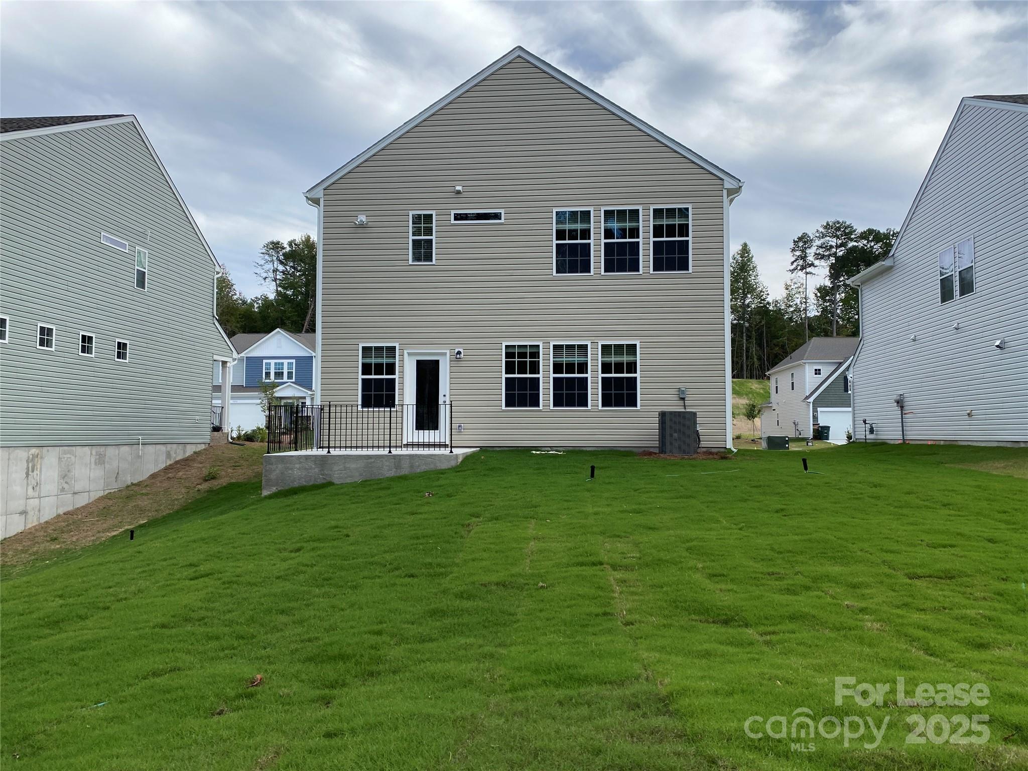 18219 Stark Way Charlotte, NC 28278 - Photo 38 of 42 a backyard of a house with table and chairs