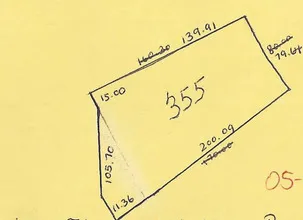 a sign on the wall next to a road