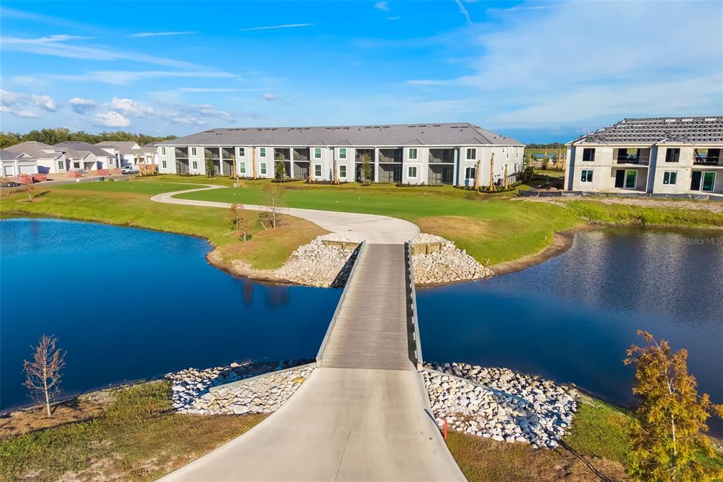 19015 Scallop Loop, Unit 204 Lakewood Ranch, FL 34211 - Photo 2 of 56 a view of a lake with a building in front of it