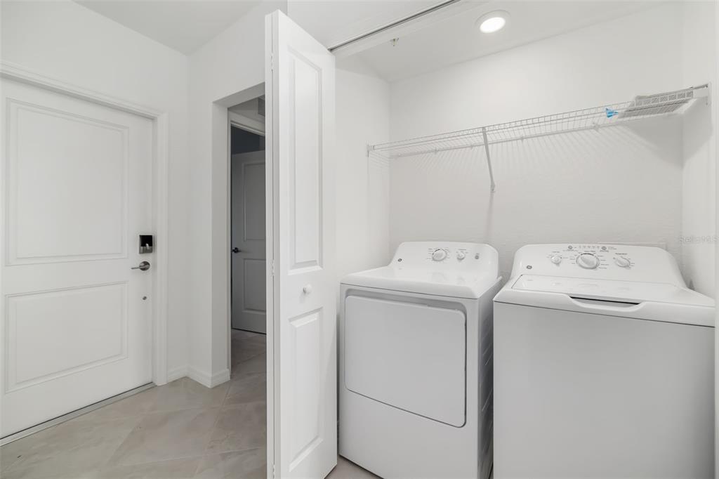 19015 Scallop Loop, Unit 204 Lakewood Ranch, FL 34211 - Photo 36 of 56 a utility room with dryer and washer