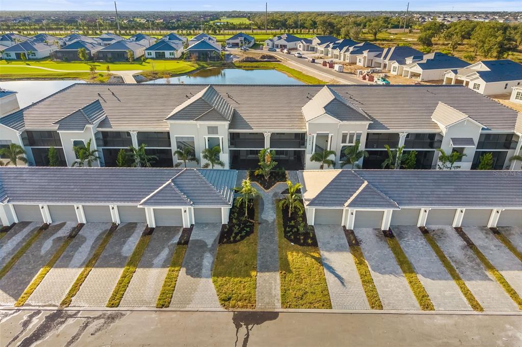 19015 Scallop Loop, Unit 204 Lakewood Ranch, FL 34211 - Photo 4 of 56 a view of swimming pool with outdoor seating