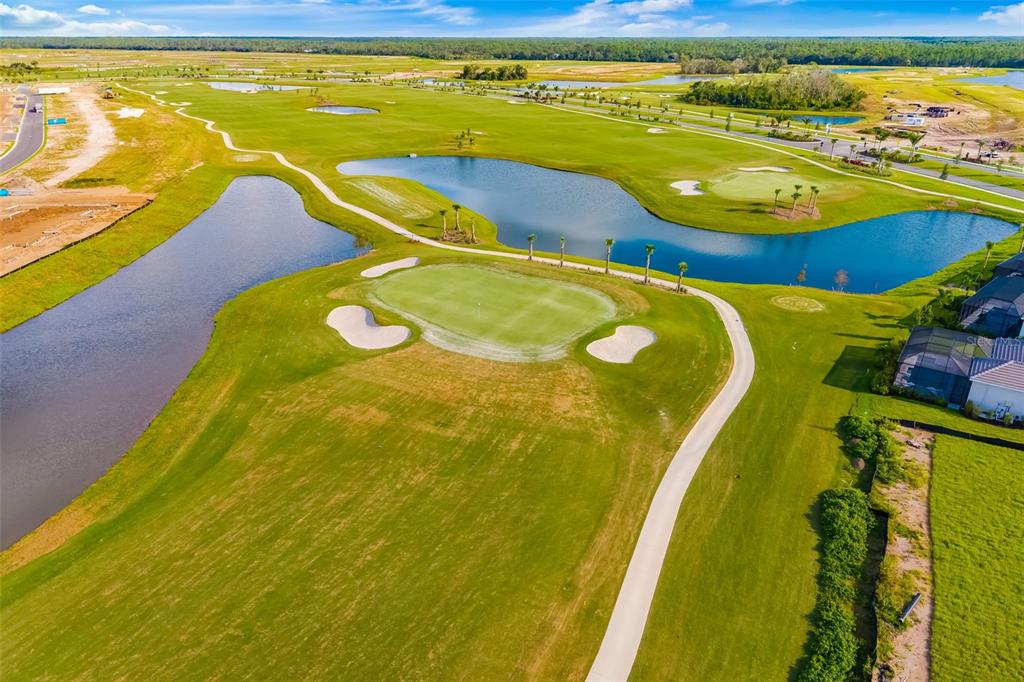 19015 Scallop Loop, Unit 204 Lakewood Ranch, FL 34211 - Photo 44 of 56 a view of a swimming pool with outdoor seating