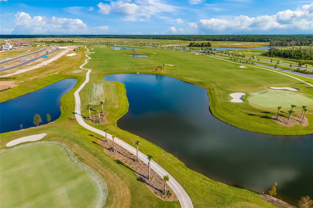 19015 Scallop Loop, Unit 204 Lakewood Ranch, FL 34211 - Photo 48 of 56 a view of a swimming pool with outdoor seating and yard