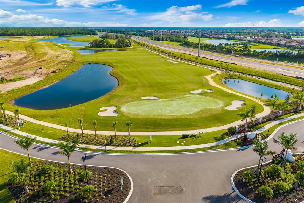19015 Scallop Loop, Unit 204 Lakewood Ranch, FL 34211 - Photo 49 of 56 a view of a swimming pool with a patio