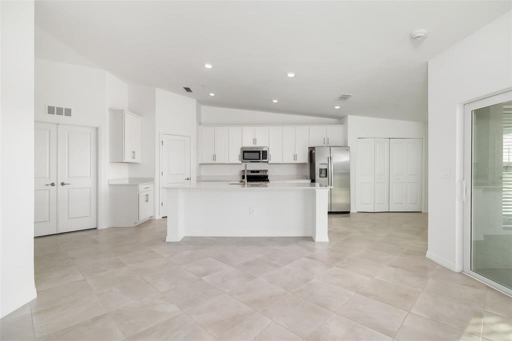 19015 Scallop Loop, Unit 204 Lakewood Ranch, FL 34211 - Photo 10 of 56 a view of kitchen with refrigerator and white cabinets