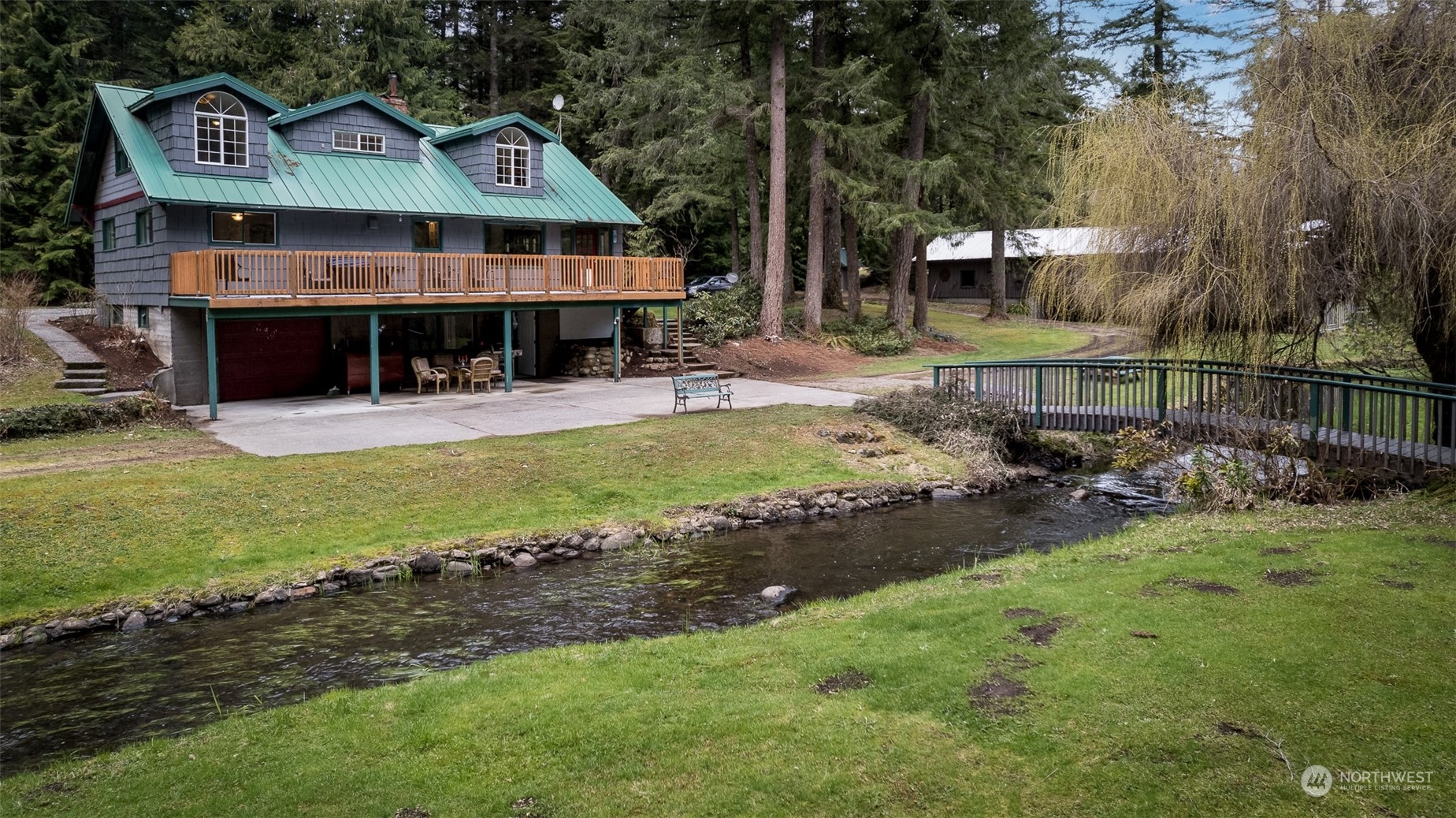 8702 Silver Lake Road Maple Falls, WA 98266 - Photo 31 of 39 a view of a house with backyard and sitting area
