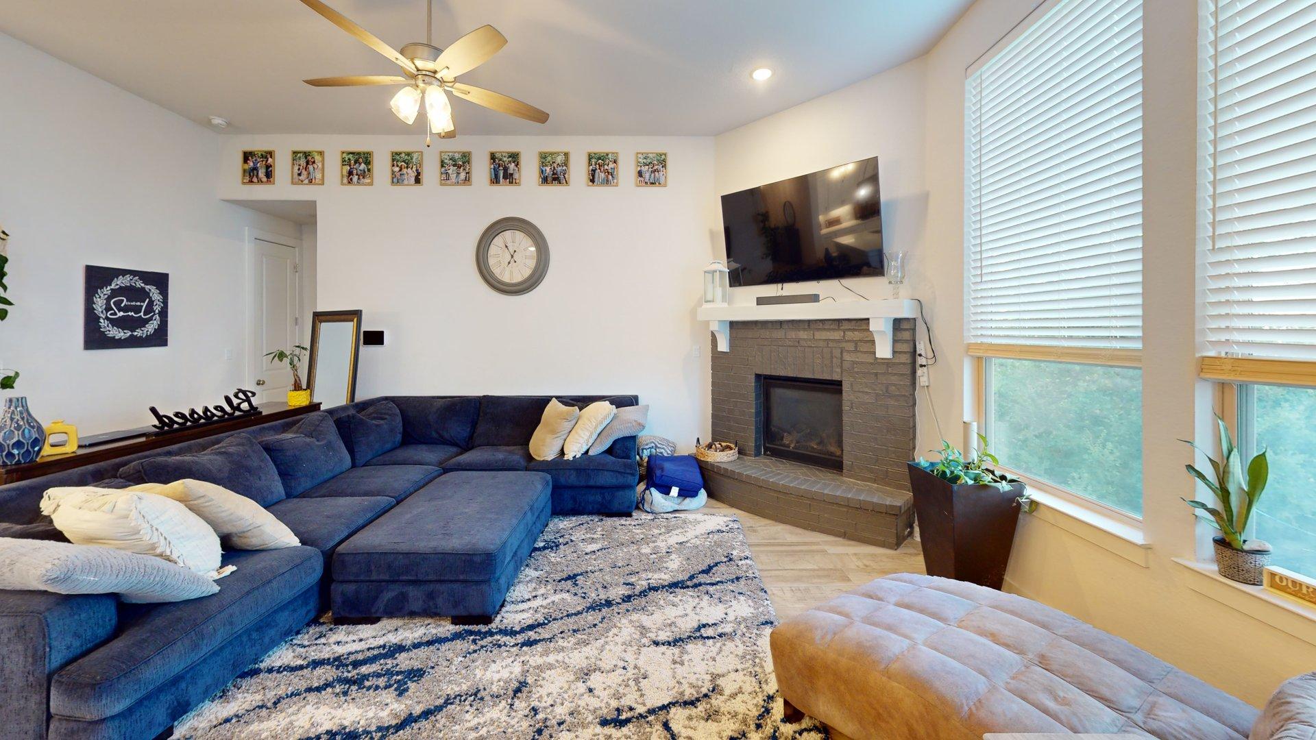 244 Heartleaf Road San Marcos, TX 78666 - Photo 6 of 26 a living room with furniture fireplace and flat screen tv
