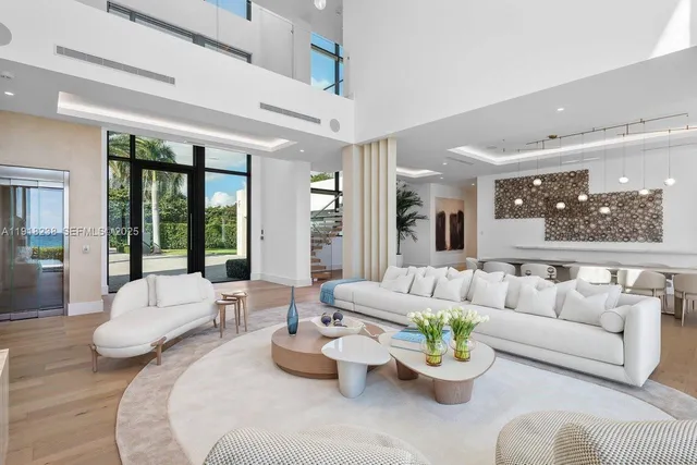 a large kitchen with stainless steel appliances a stove a sink dishwasher and a refrigerator