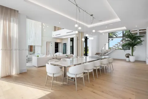 a large living room with furniture and a flat screen tv