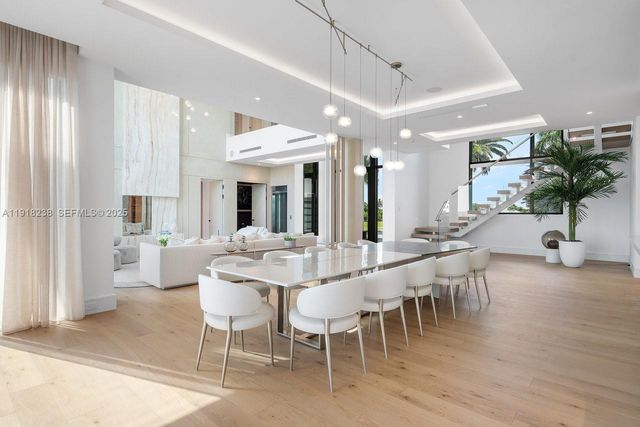 a large living room with furniture and a flat screen tv