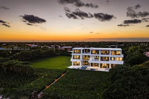 a view of a city with tall buildings and a big yard