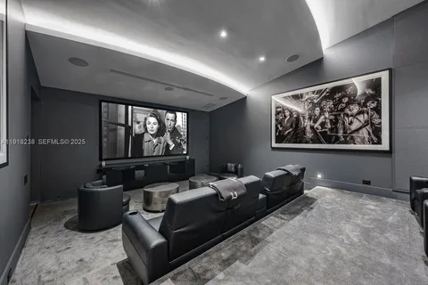 a kitchen with stainless steel appliances kitchen island granite countertop a stove and a sink