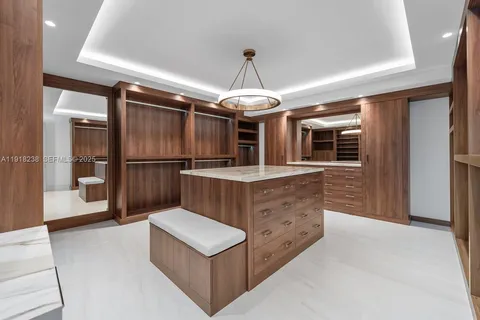 a bathroom with a double vanity sink toilet and shower