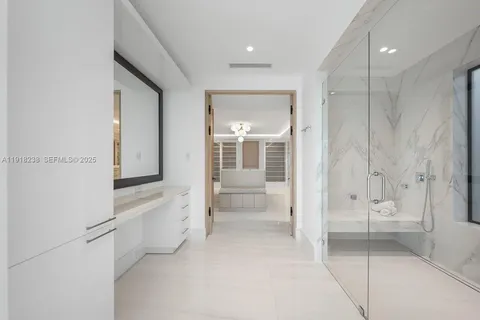 a bedroom with bed and a couch