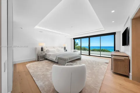 a view of a patio with couches potted plants and a big yard