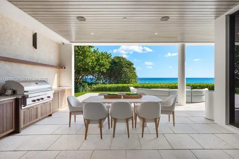 a bedroom with a bed and large window