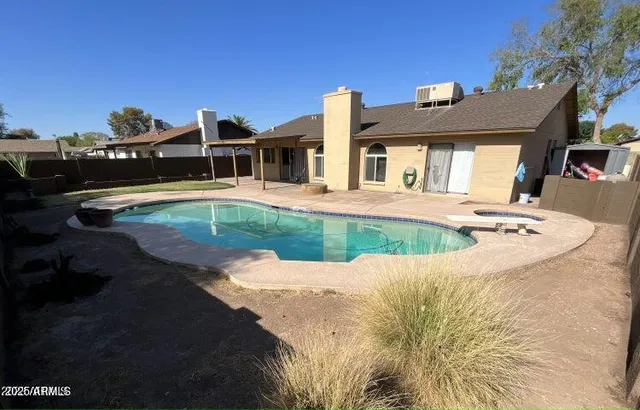 a view of a house with swimming pool