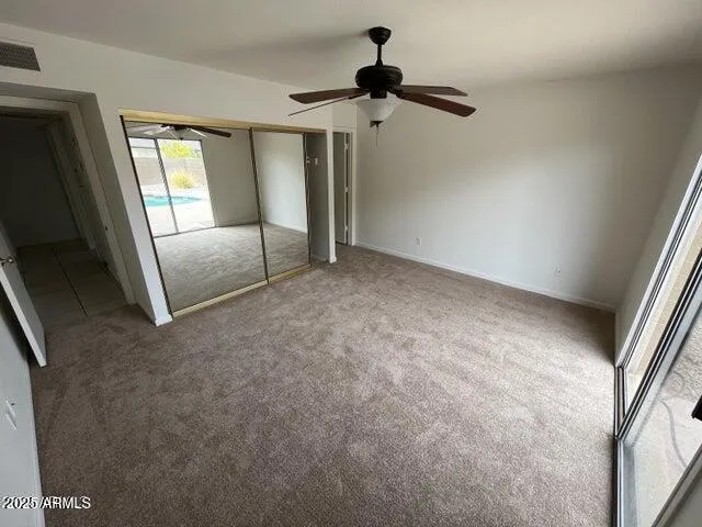 a view of an empty room and a window