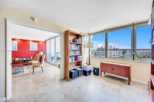 a kitchen with granite countertop cabinets and refrigerator