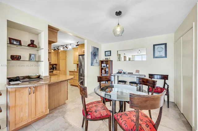 a view of a chairs and table in a balcony